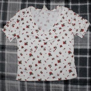 White v-neck top with red roses